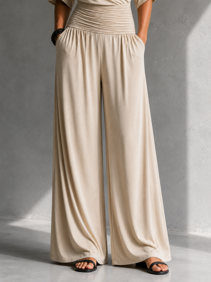 Alia | Mono elegante con efecto cruzado y pernera ancha